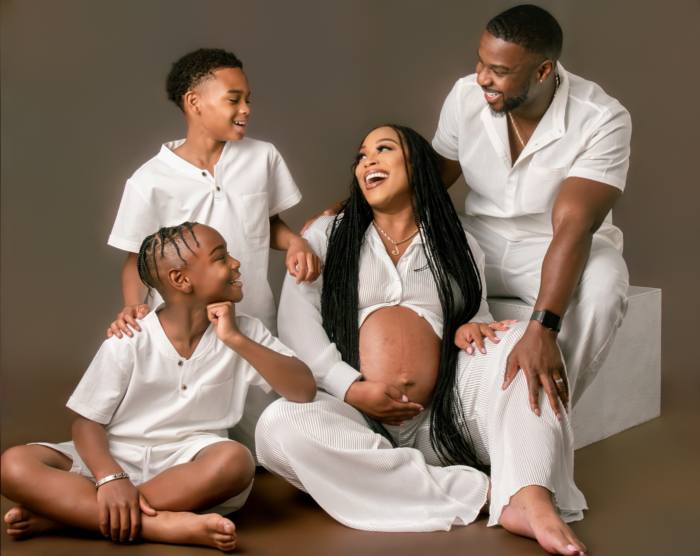 Family maternity portrait photographed by Portrait Pros